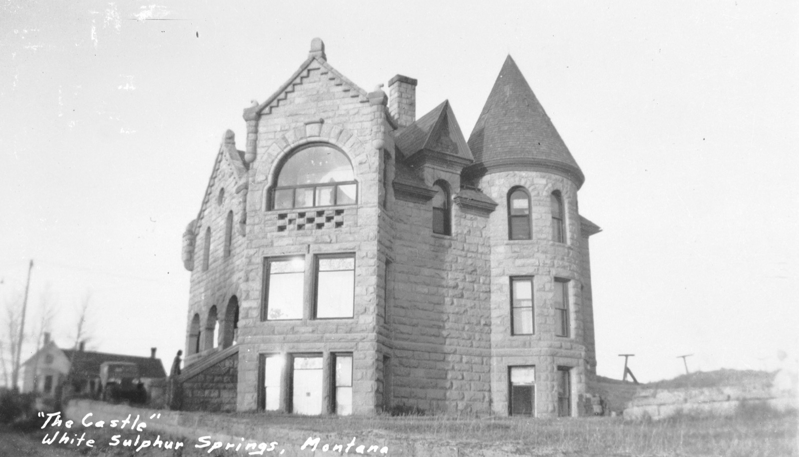 Vintage postcard photograph of the Castle, a stone Victorian mansion in White Sulphur Springs, Montana